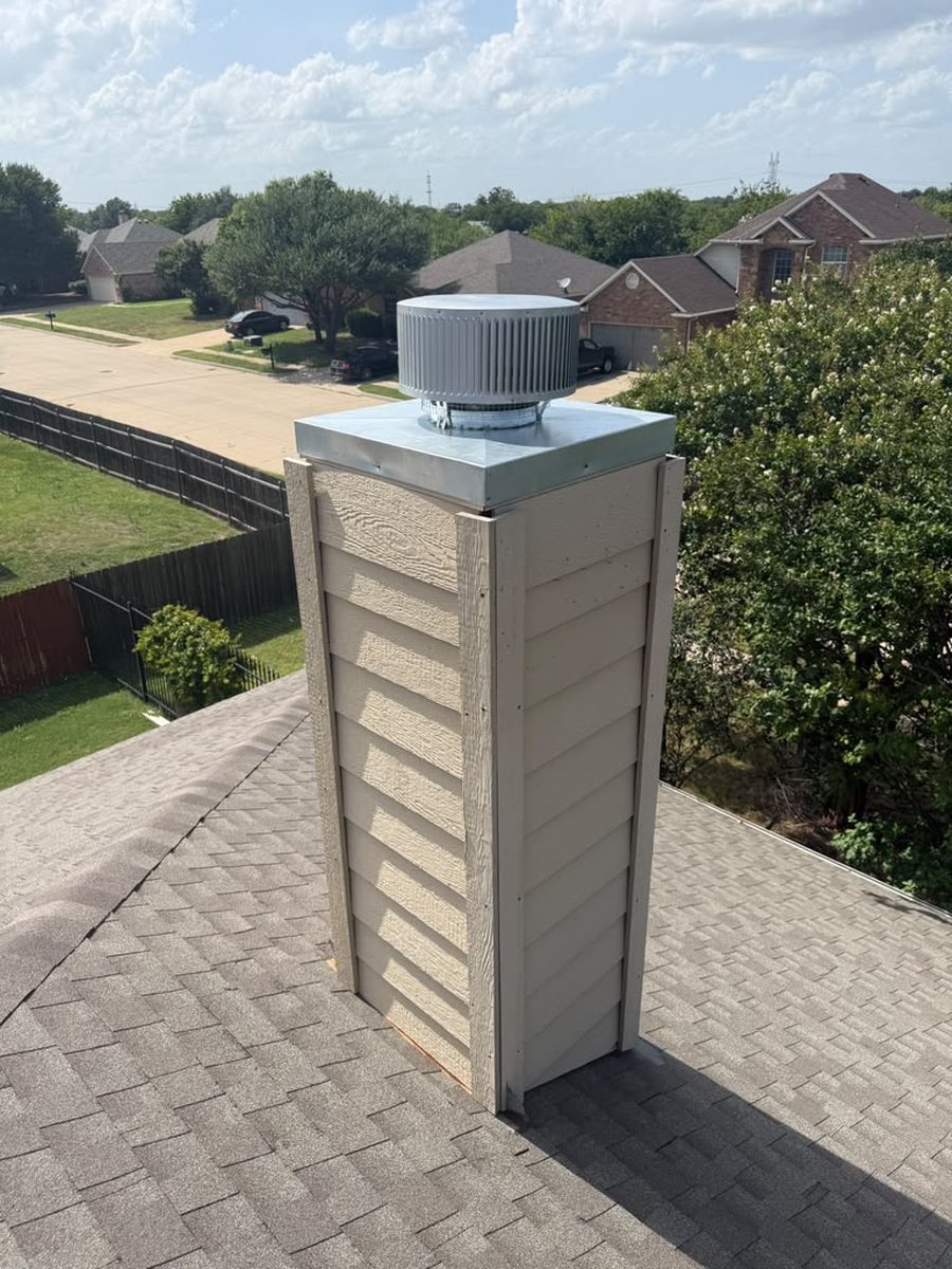 Completed chimney cap and siding installation on a DFW home